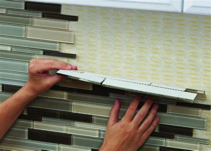 Can you put adhesive tile over tile